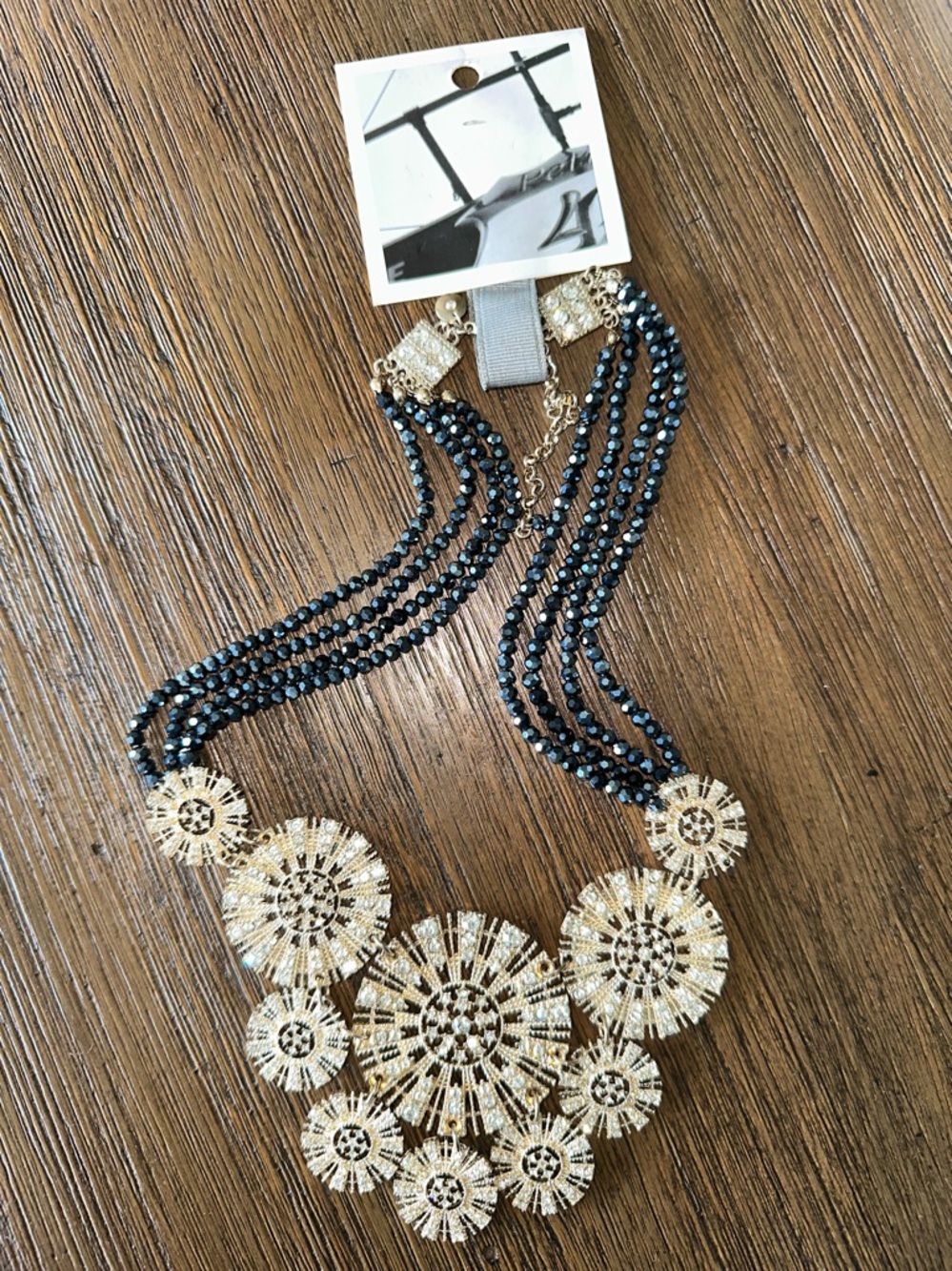 Anthropologie Gold and Blue Crystal Medallion Necklace